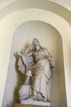 Detail of a statue of a woman in an alcove