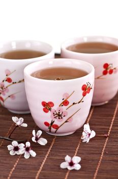 Three teacups filled with japanese green tea