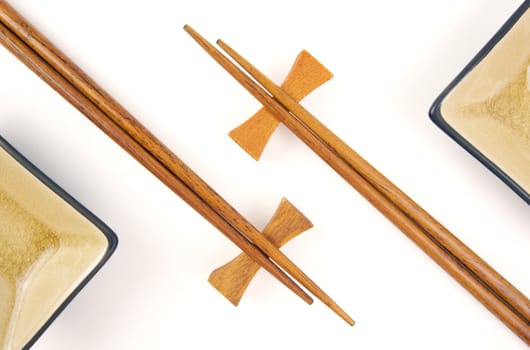 Abstract Chopsticks and Bowls Isolated on a White Background.
