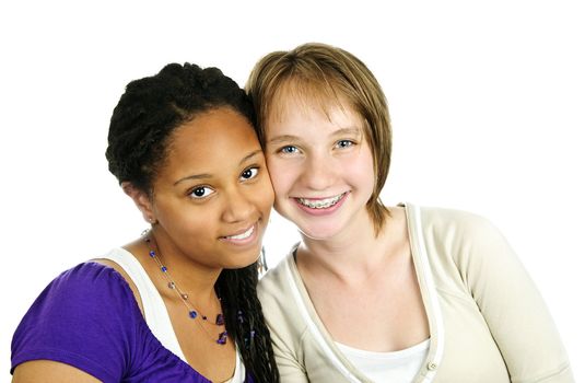 Isolated portrait of two diverse teenage girl friends