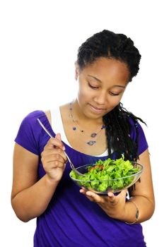 Isolated portrait of black teenage girl with salad bowl