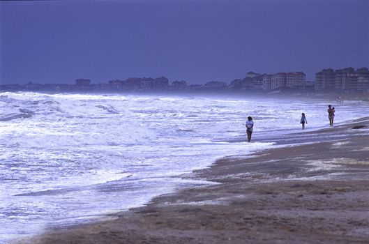 people on beach stormy ocean Amelia Island Florida