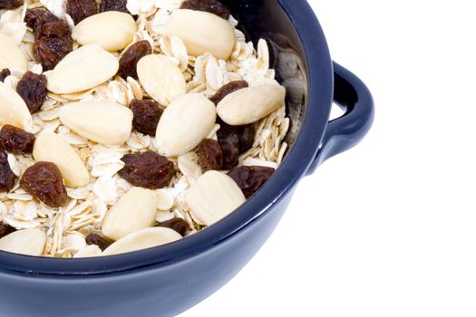 a bowl of oatmeal with raisins and almonds - healthy diet