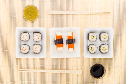 a plate with different kinds of sushi