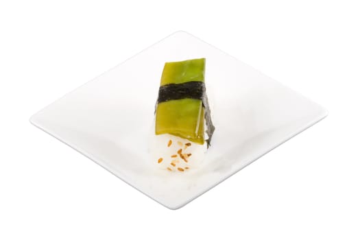 a square white plate with a piece of sushi