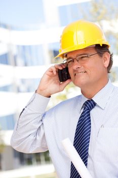 Handsome Contractor in Hardhat and Necktie Smiles as He Talks on His Cell Phone.