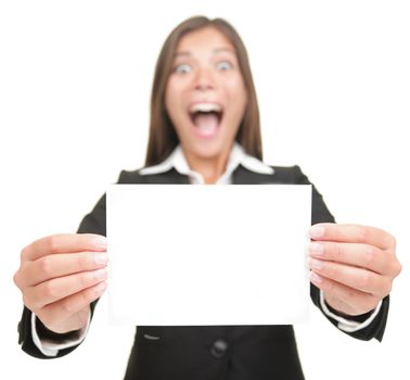 Business woman excited holding empty blank sign. Smiling version also available,  Beautiful mixed Chinese Asian / Caucasian businesswoman. Isolated on seamless white background. 