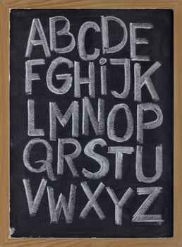 twenty six letters of English alphabet (upper case) - white chalk handwriting on blackboard