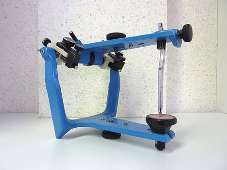 Blue metallic articulator for dental technician