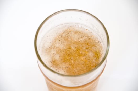 A pint of beer isolated on a white background