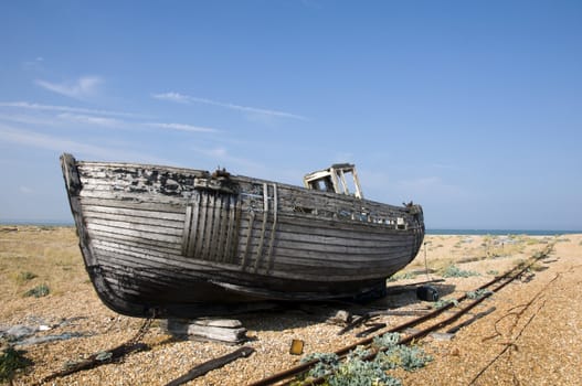 An old fishing boat on the beach at Dungeness