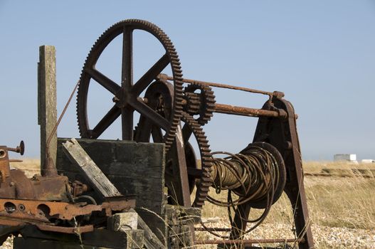 An old fishermans winch on the beach