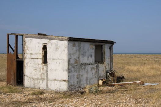 An abandoned beach hut on the beach at Dungeness