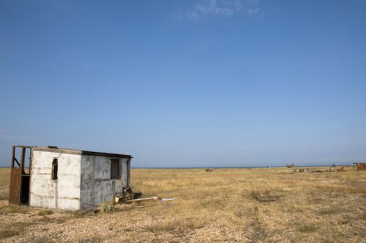 An abandoned beach hut on the beach at Dungeness