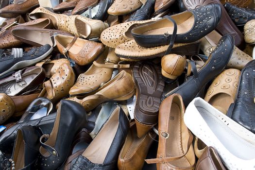 Pile of women's shoes, full frame.
