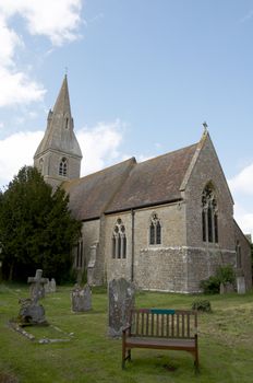 A rural church with graveyard and head stones