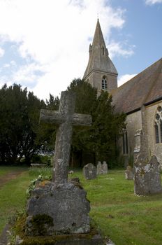 A rural church with graveyard and head stones
