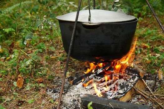 Old pot on a campfire