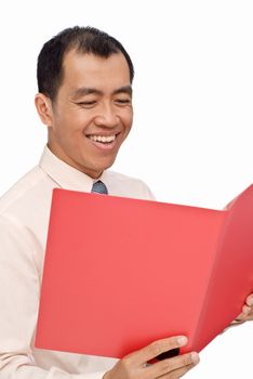 Happy businessman read report on red folder on white background.
