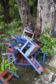 Colorful discarded chairs near a tree in Nicaragua