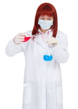 Woman scientist mixes colored chemical solutions on white background