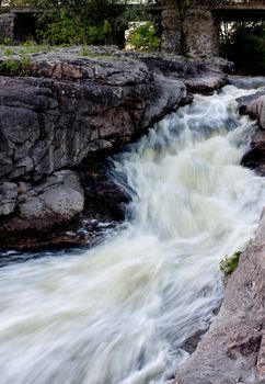 blurred stream of water between two rocks