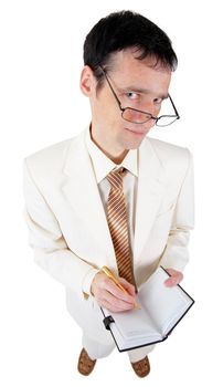 Funny young business man with a notebook on a white background