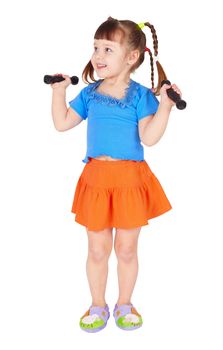 The little girl in a dress with dumbbells in hands on a white background