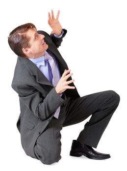 A young man scared and sat on a white background