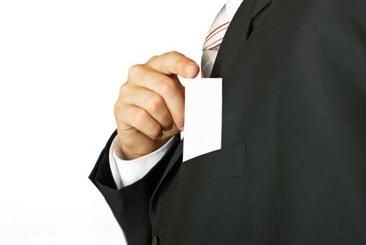 Young businessman holding blank visit card. Backside. Isolated.