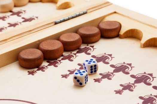 View of dice and game pieces during backgammon game. Double five.