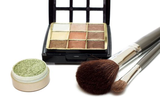 Makeup set with brushes and eye shadows isolated on white