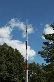 A red and white communications tower