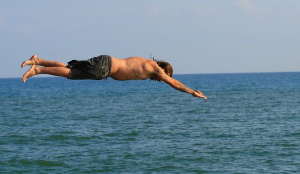 Man jumping into the sea