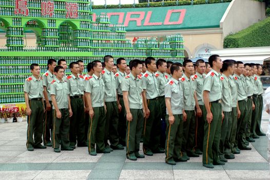 Chinese soldiers during outdoor trip, gathering in front of Window of The World, Shenzhen, China.