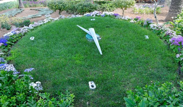 Grass clock, showing half past elleven at San Anton Gardens on Malta.
