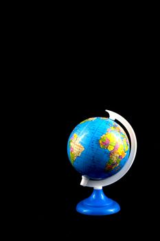 school globe isolated on a black background