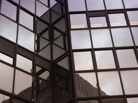 a close-up image of reflections on offices buildings