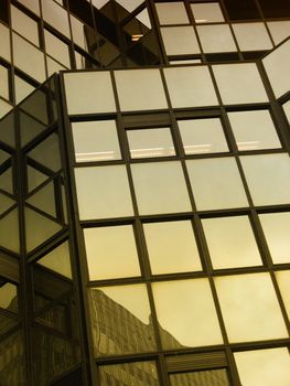 a close-up image of reflections on offices buildings