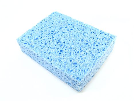 a blue sponge over a on a white background