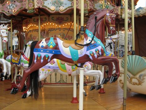 a view of some colored carousel horses