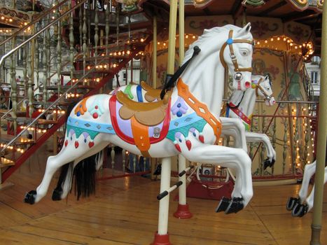 a view of some colored carousel horses