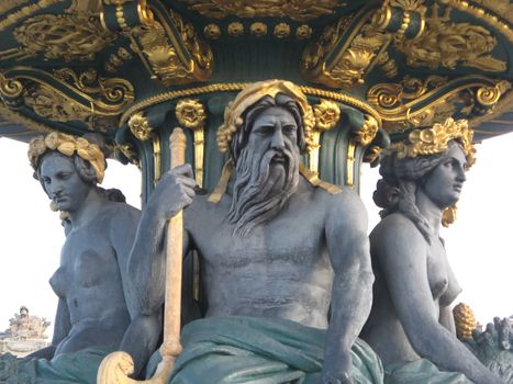 three statues of the Concorde square fountain in Paris