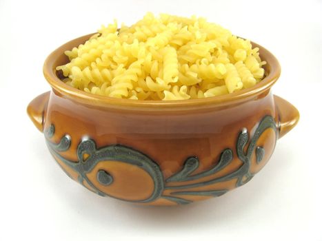 an image of a brown bowl full of pastas