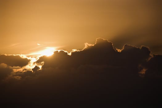 Sun peeking through cloud.