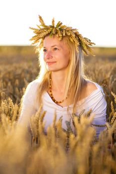 happy girl in field of wheat