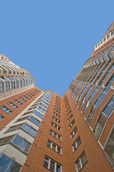 A residential multistory house and sky, view from below