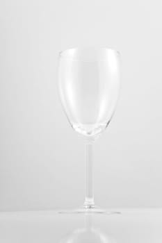 Empty white wine glass on white background