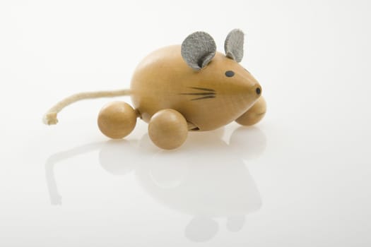 wooden mouse painted on white background