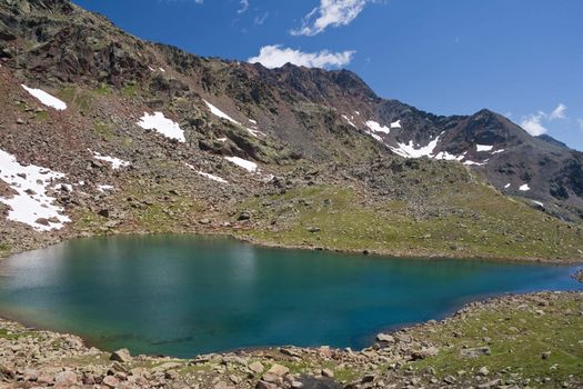 summer view of Marmot lake, in Stelvio National park, Trentino, Italy. Photo taken with polarized filter